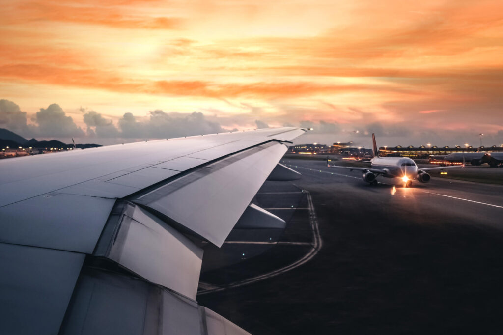 wing_of_an_airplane_taking_off_on_runway.jpg