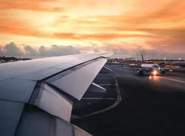 wing_of_an_airplane_taking_off_on_runway.jpg