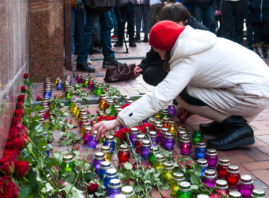 woman_lays_flowers_in_front_of_iranian_embassy_in_ukraine.jpg