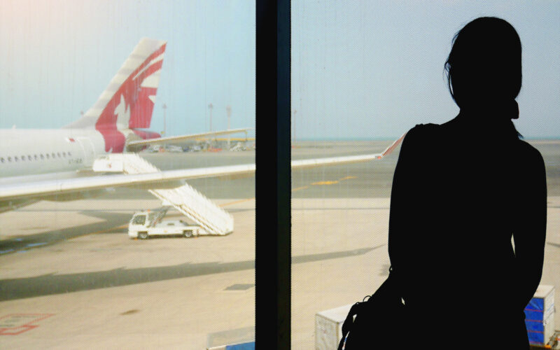 woman_waiting_to_board_in_doha_airport.jpg